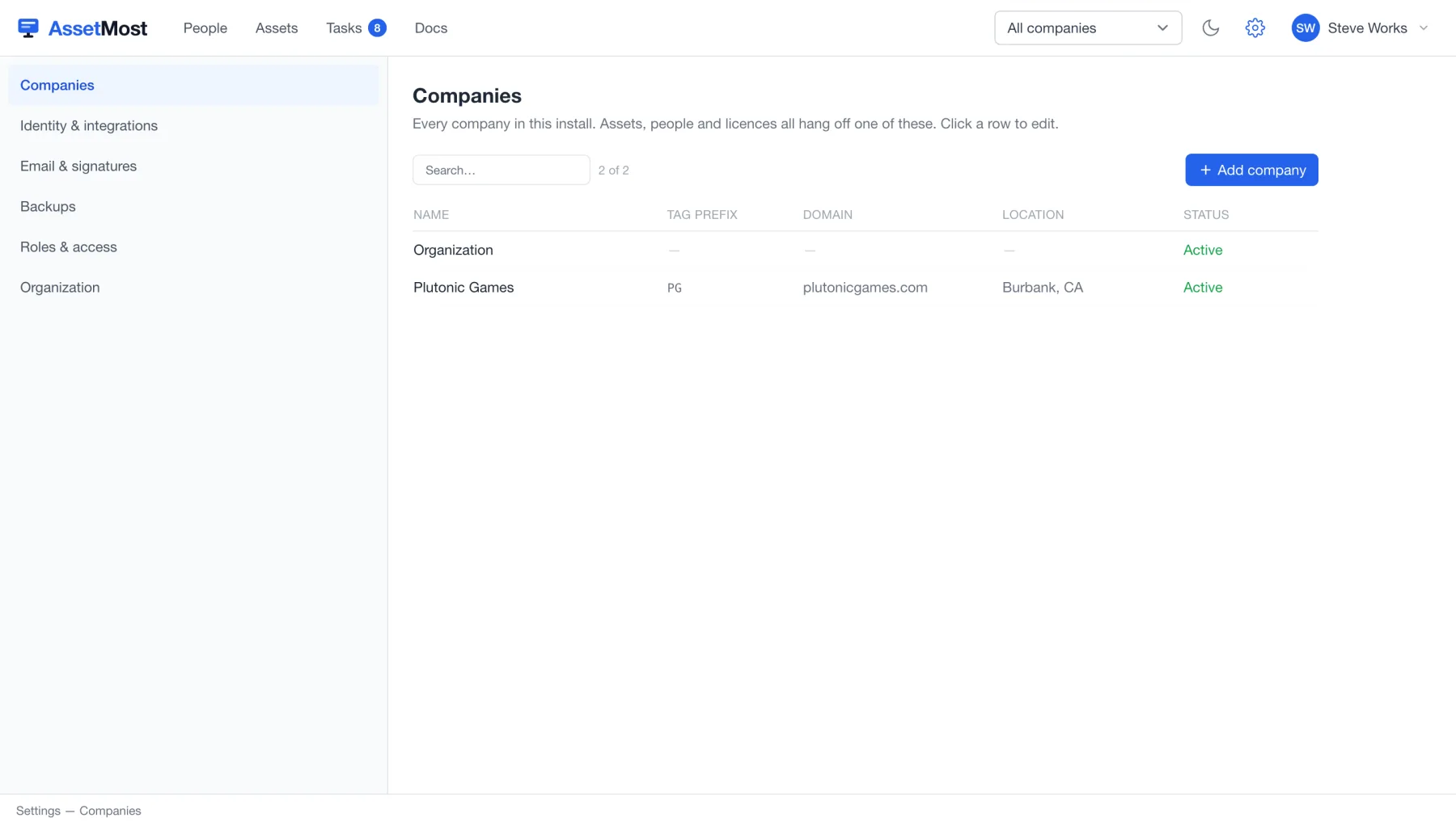 Settings → Companies: each company with its tag prefix, domain, and status